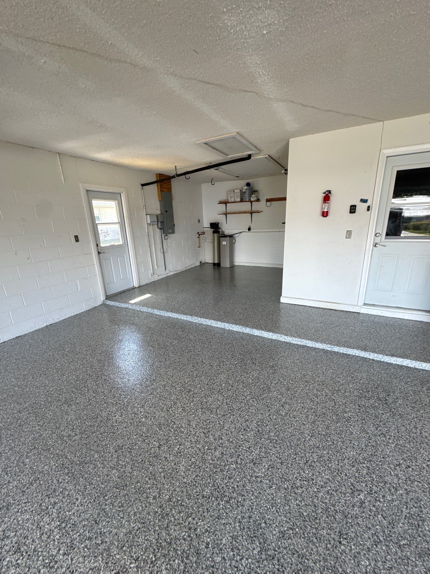 Garage floor after coating — Performance Floors & Coating Tampa